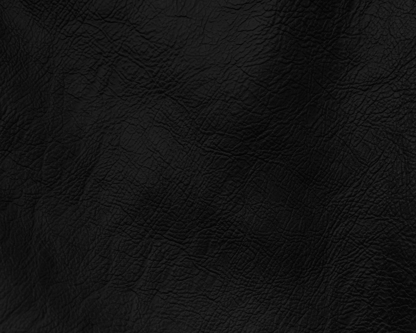 A close up of a black leather texture with a slight pattern (abstract, black, fabric, leather)