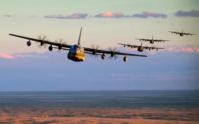 Formation of Lockheed C-130 Hercules Aircraft in Flight