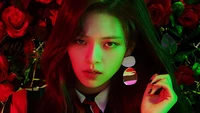 Jeongyeon do TWICE entre rosas vibrantes e cores marcantes.