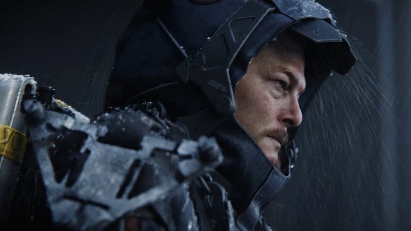 Мужчина в шлеме и куртке, держащий пистолет (death stranding, видеоигра, сам портер бриджес, sam porter bridges)