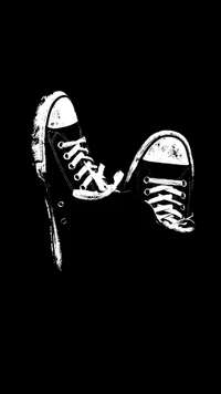 Black Sneakers on a Dark Background