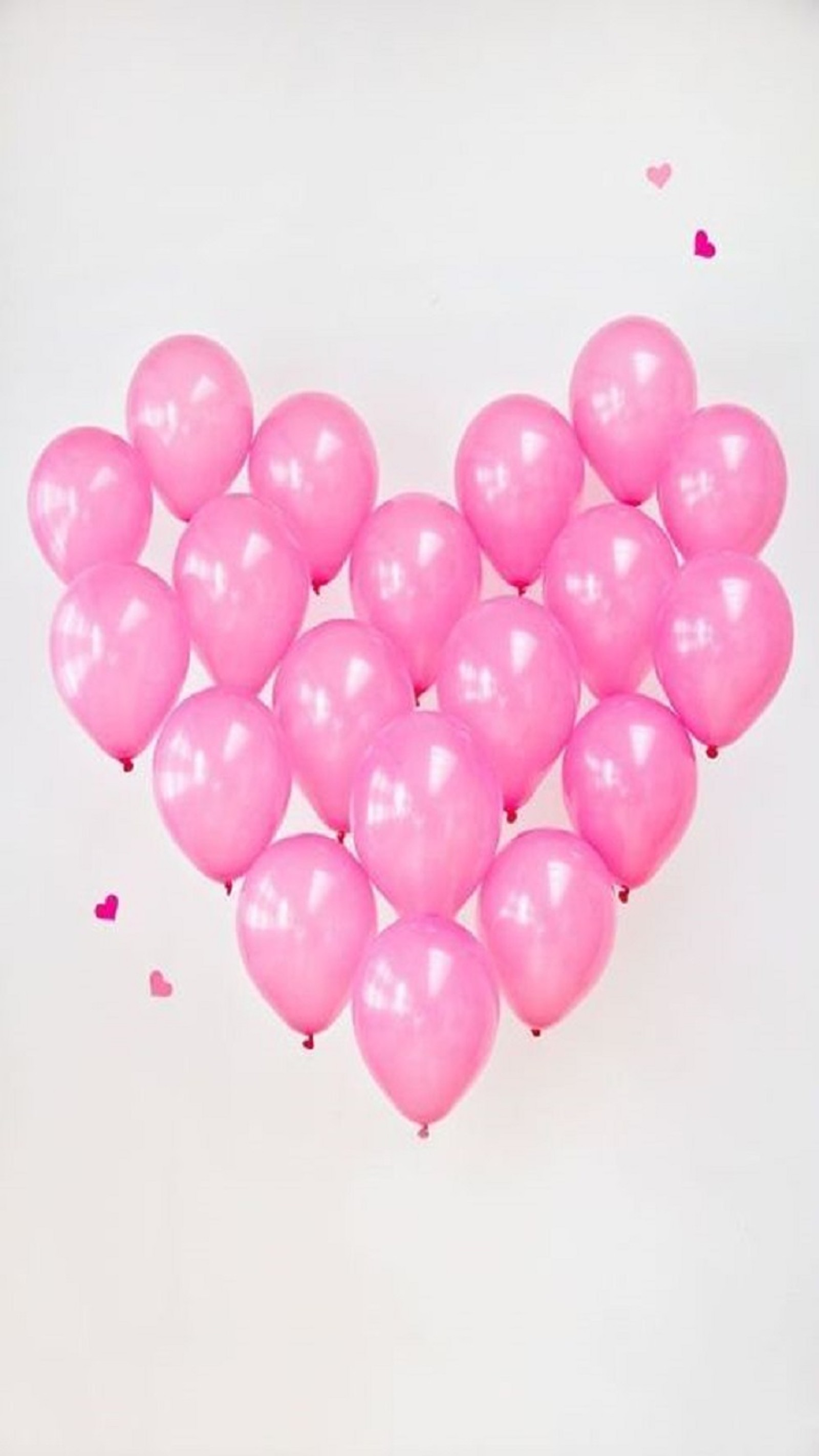 A close up of a heart shaped balloon with confetti on a white background (cute, heart, hearts, i love you, love)