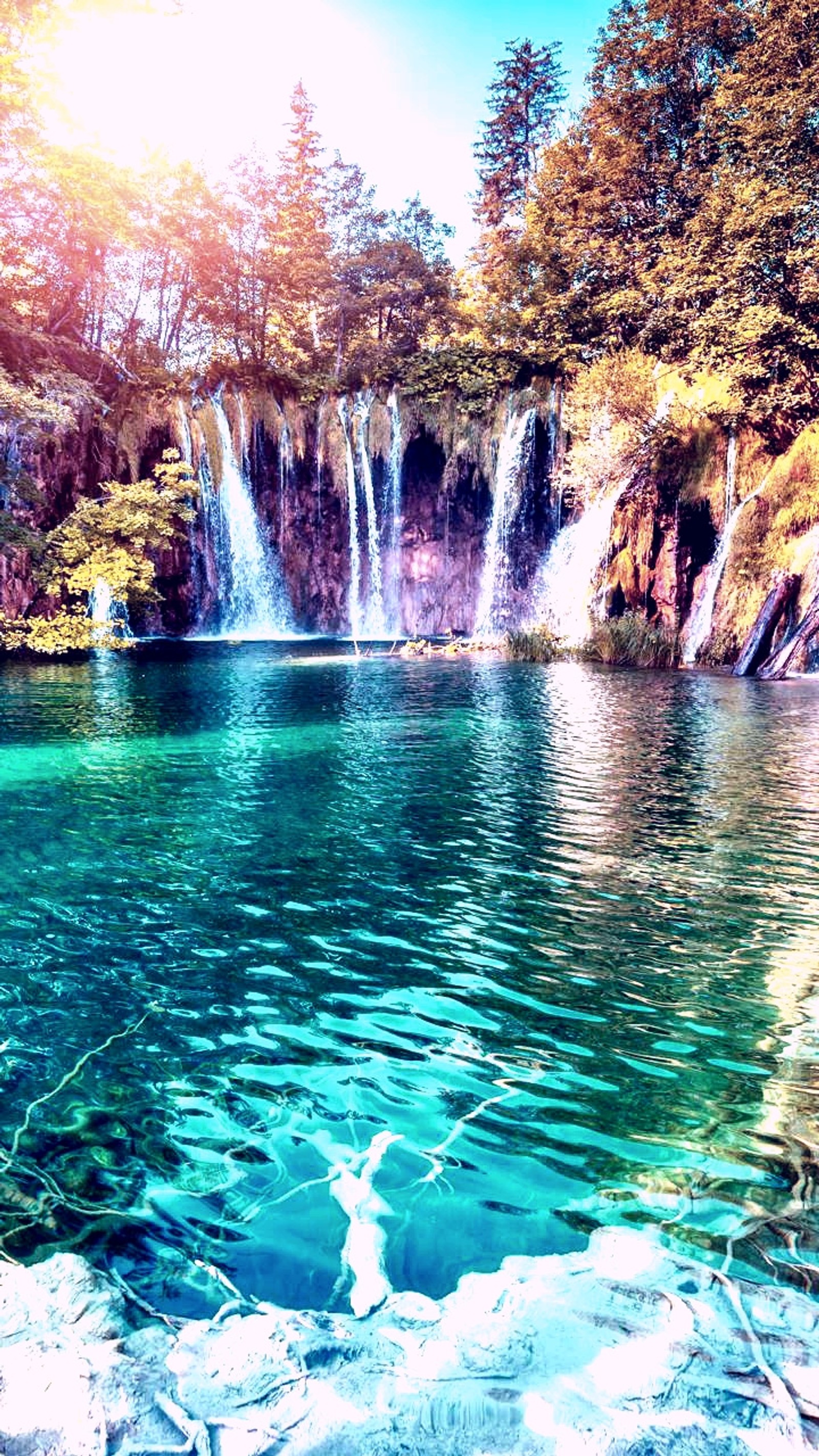 Arafed view of a waterfall in the middle of a lake (beautiful, nature, water)