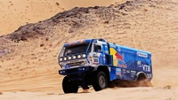 Kamaz Master truck navigating through desert sands in an off-road rally race.