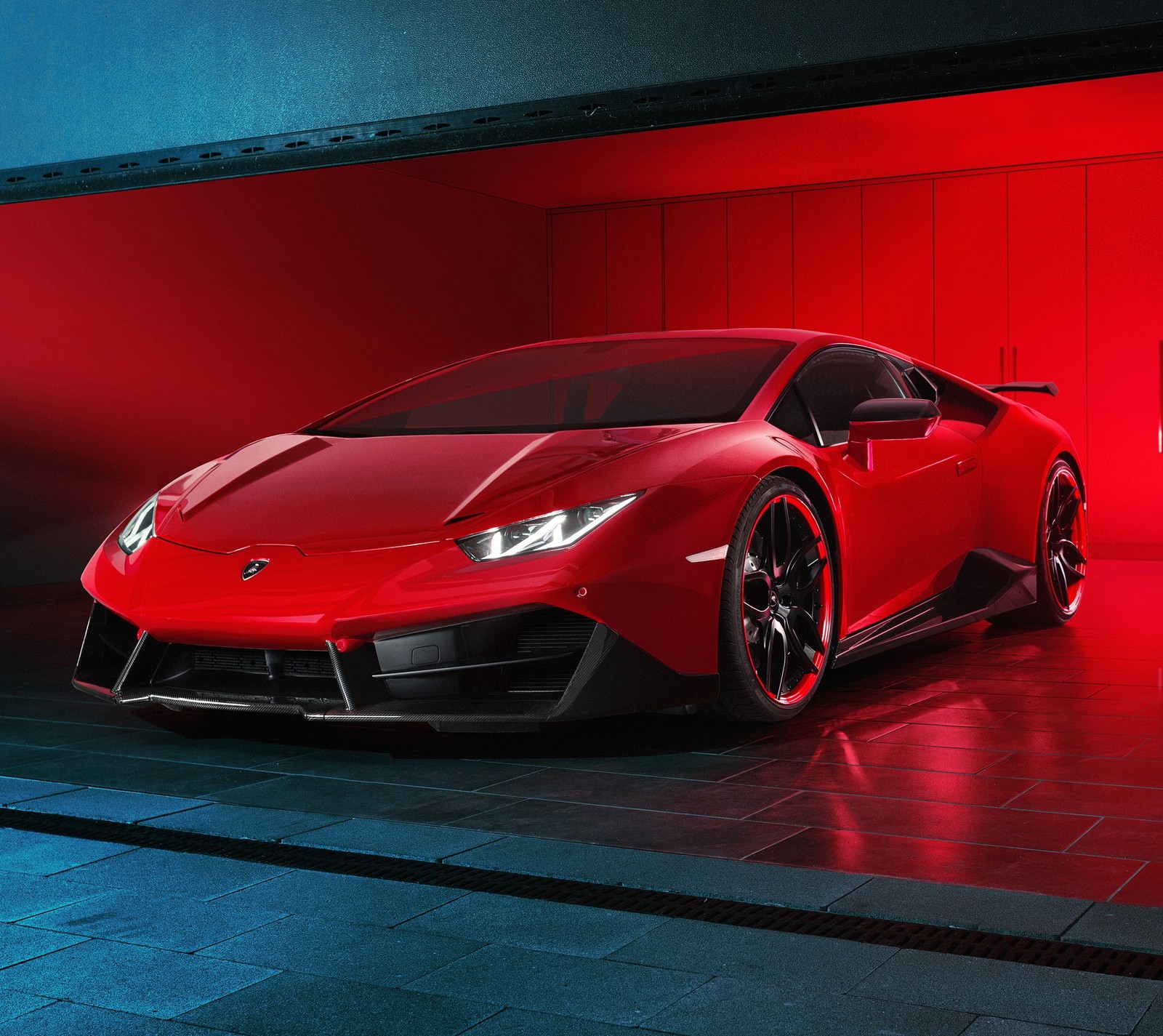 A close up of a red sports car parked in a garage (fun, lamborghini)