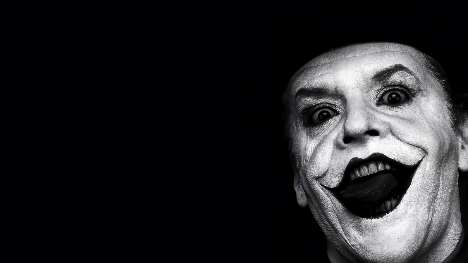 Eine nahaufnahme eines mannes mit einem lächeln im gesicht (joker, superbösewicht, bösewicht, jack nicholson)