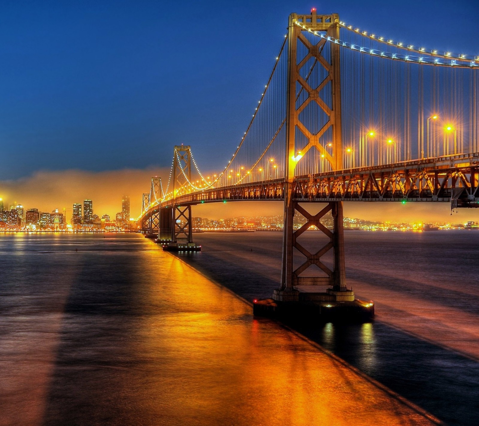 Arafed view of a bridge over a body of water at night (america, bridge, gate, golden, san francisco)