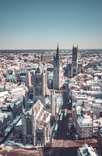 Snow-Covered Cityscape with Historic and Modern Architecture