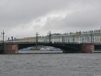 City Bridge Over River with Powerboat and Historic Buildings