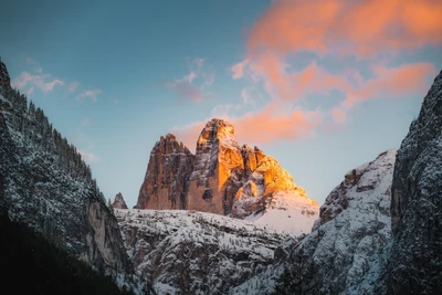 Golden Hour Glow on Tre Cime di Lavaredo: Majestic Snow-Covered Peaks in the Italian Alps