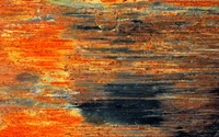 Textured Rust and Wood Stain on Metal Surface