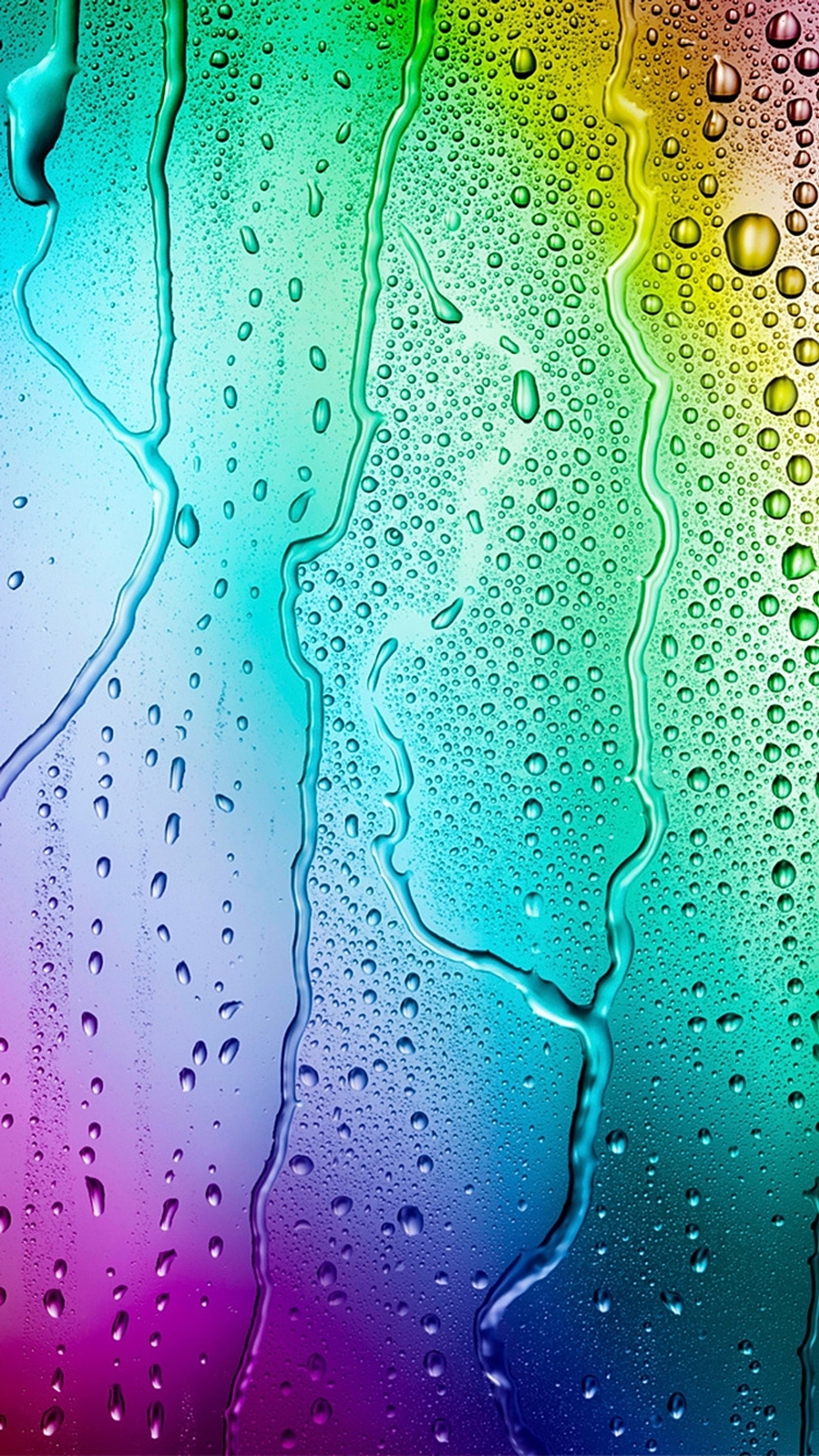 Un primer plano de gotas de lluvia de colores del arcoíris en una ventana (android, color, droide, gota, maxx)