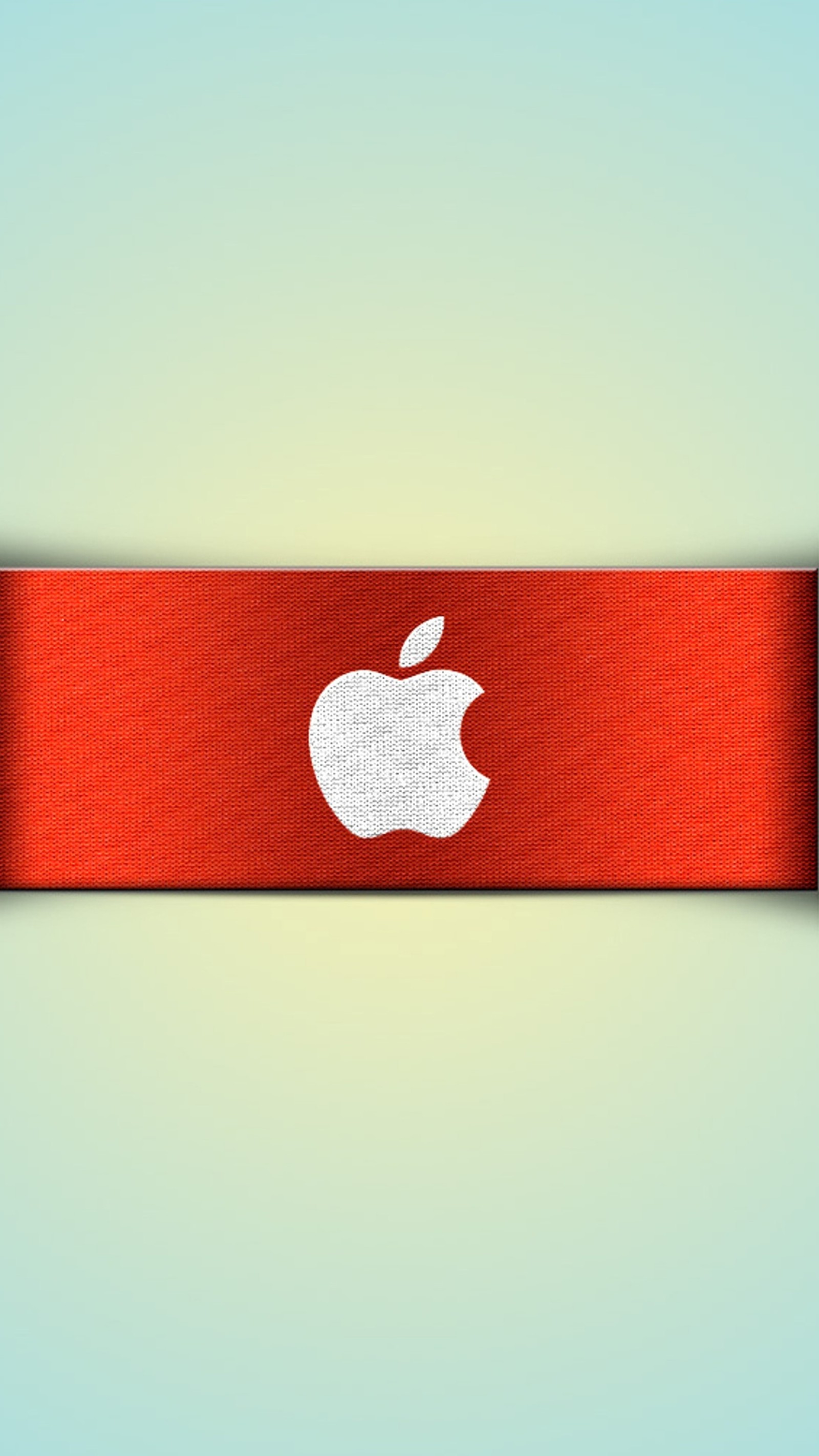 There is a red ribbon with an apple logo on it (apple, logo, red)