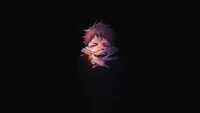 Yuji Itadori in a dark, intense sorcery battle from Jujutsu Kaisen.