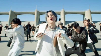 Jimin of BTS performing with dynamic energy in a vibrant dance sequence from the "ON" music video.