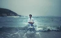 Businessman Embracing the Ocean Waves