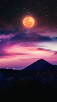 Majestic Moonrise Over Mountainous Landscape Under Starry Sky