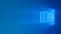 Logotipo brilhante do Windows 10 em um fundo azul - Papel de parede 4K