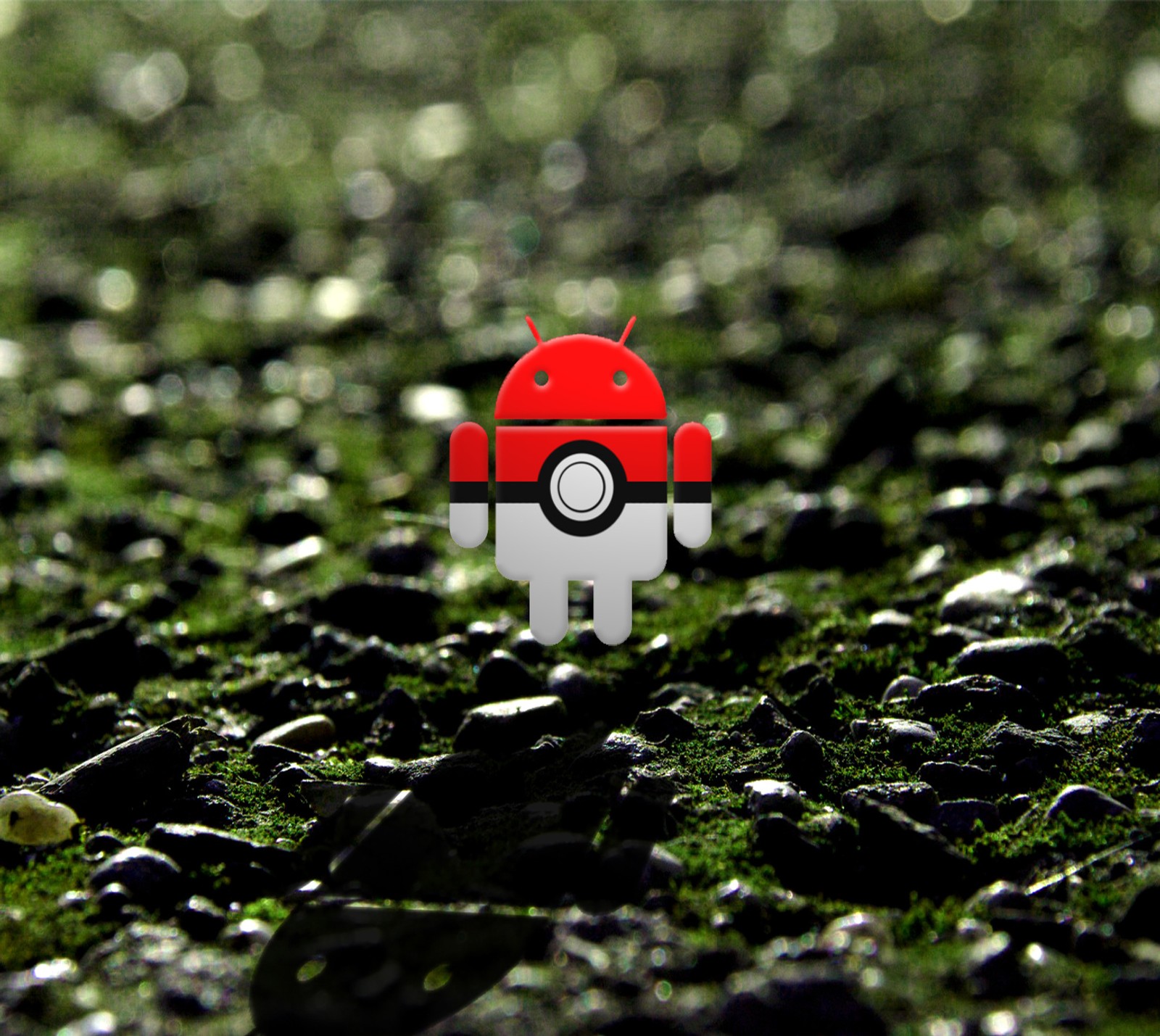 There is a small red robot sitting on a pile of rocks (android, forest, logo, nature, pokeball)