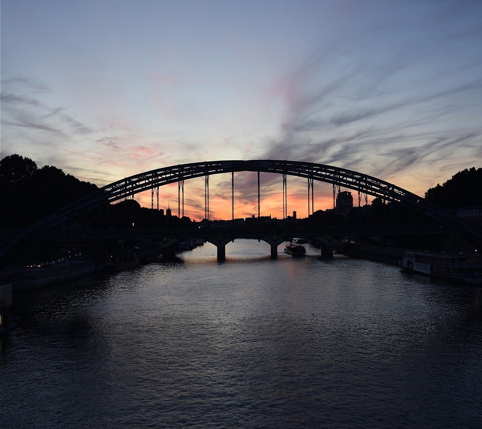 Arafed bridge over a river with a sunset in the background (landscape, nature)