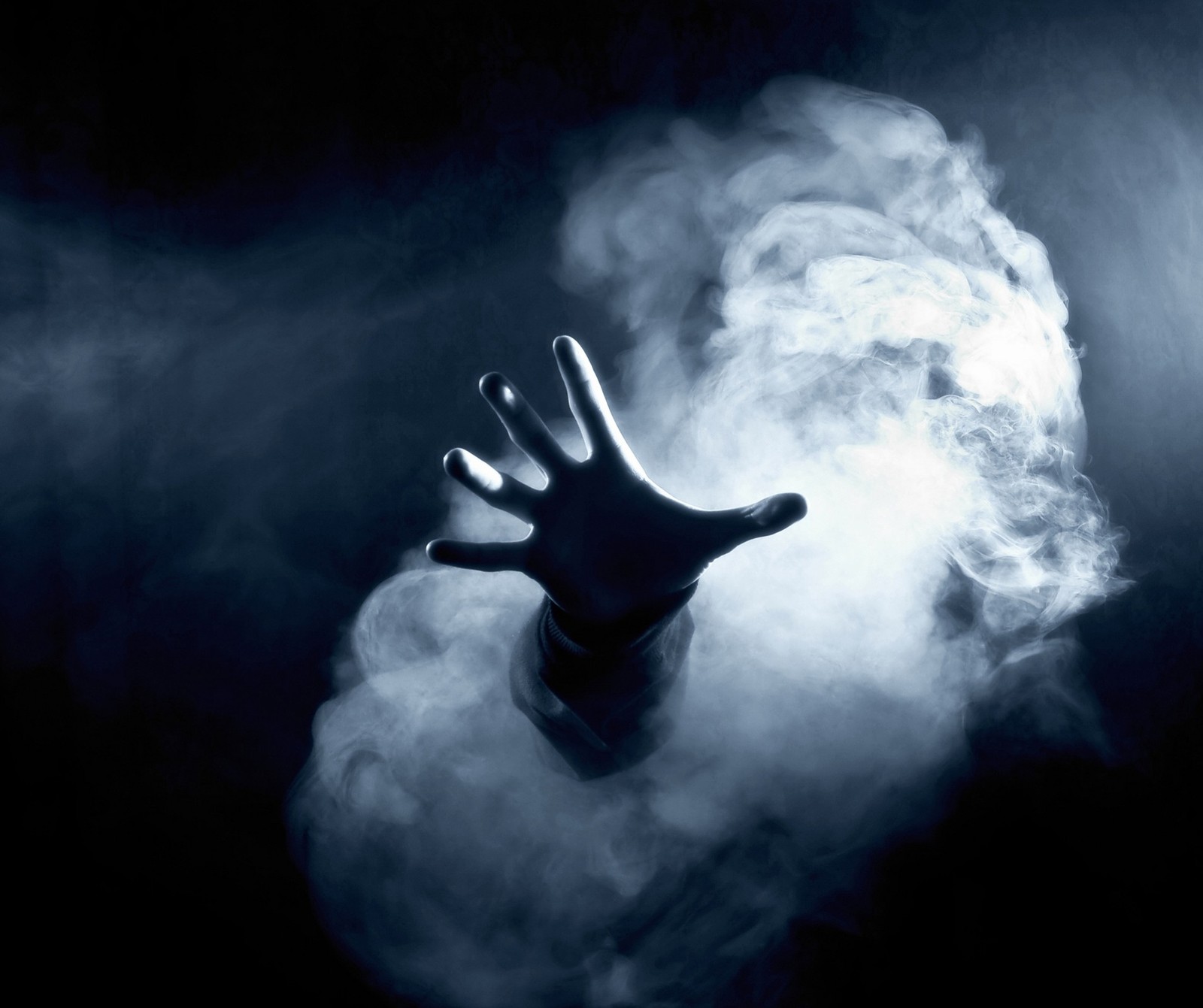 Arafed hand reaching out of a cloud of smoke (meem, rubab)