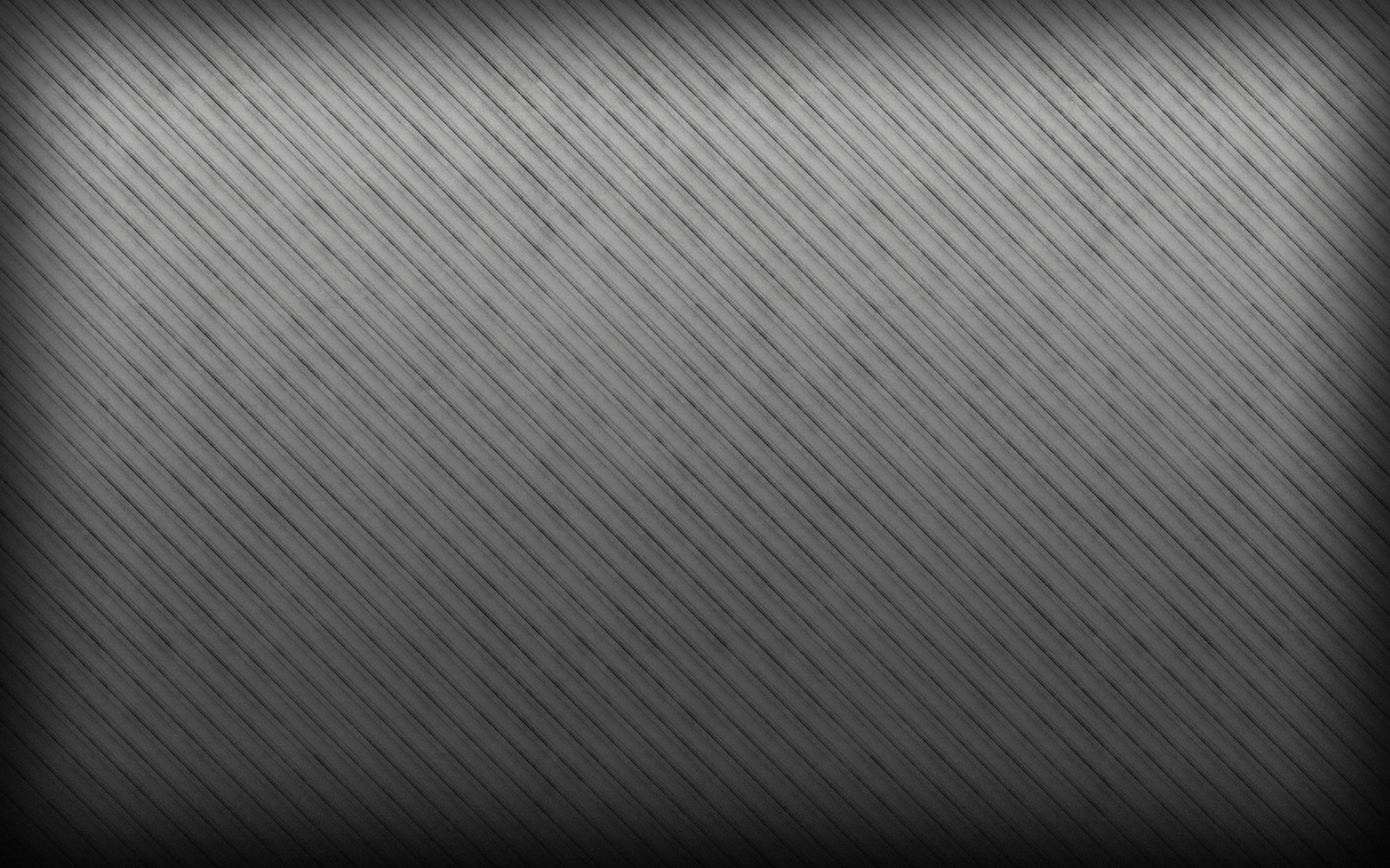 A black and white photo of a metal plate with a diagonal pattern (texture, color, line, pattern, monochrome)