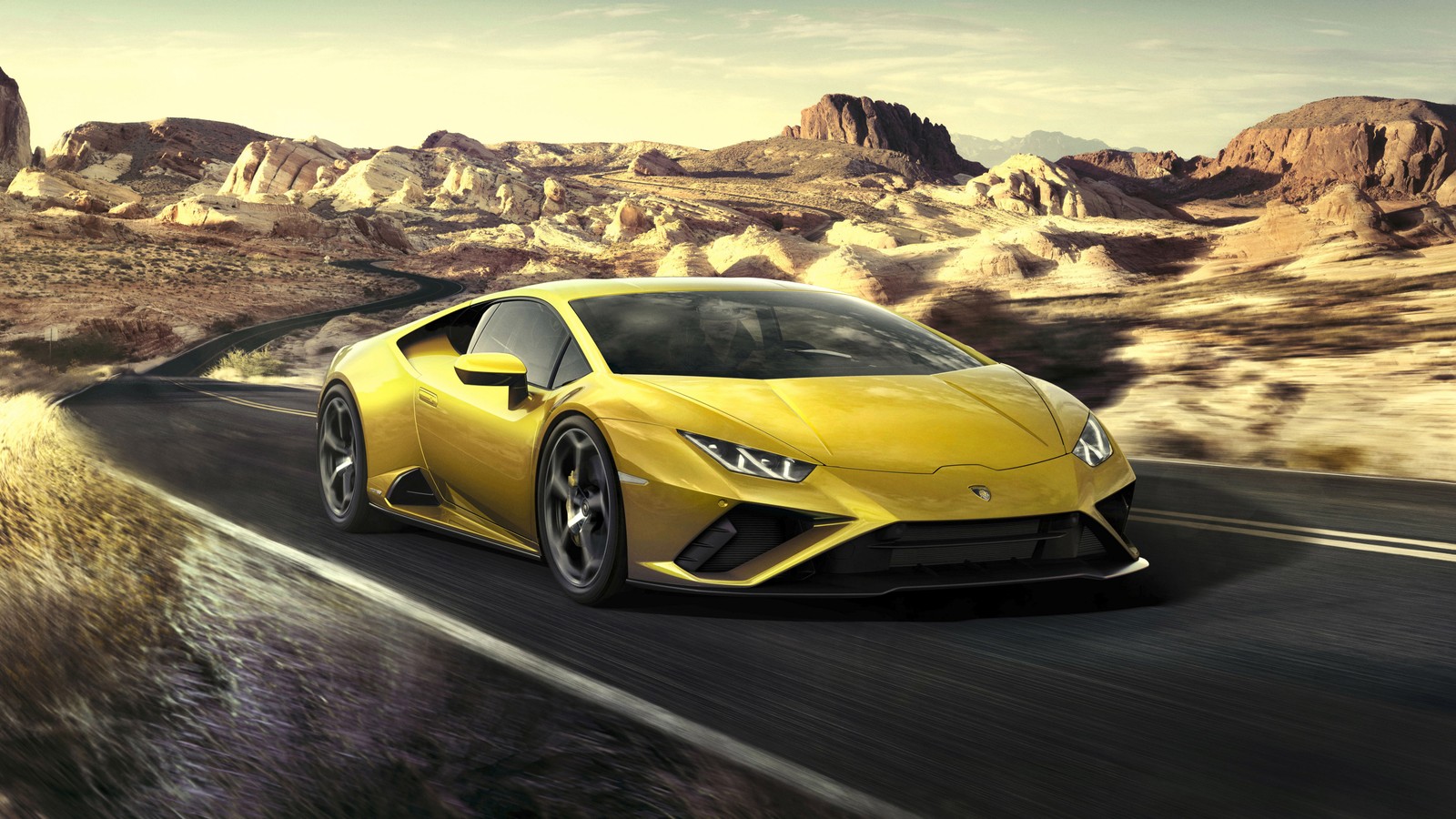 Un coche deportivo amarillo lamborghini conduciendo por una carretera en el desierto (lamborghini, coches, coche deportivo, conducción, neumático)