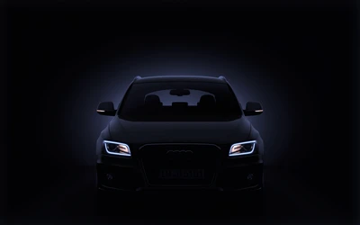 Black Audi with LED Headlights in Dramatic Lighting