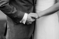 Elegant Gesture of Love: A Black and White Illustration of a Couple Holding Hands