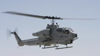 Military Helicopter in Flight: Bell AH-1 Cobra