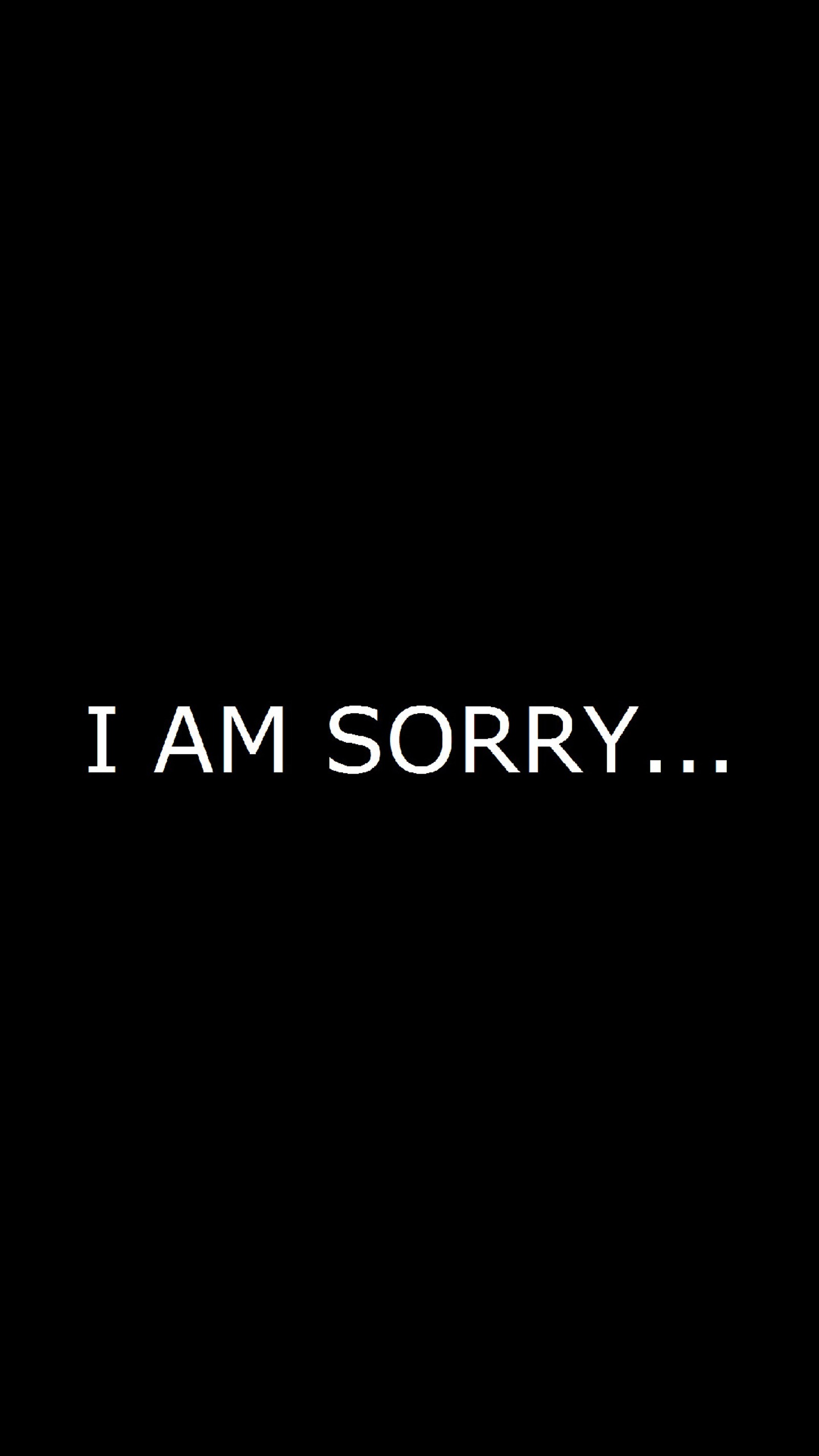 A close up of a black background with a text that says i am sorry (black, sorry)