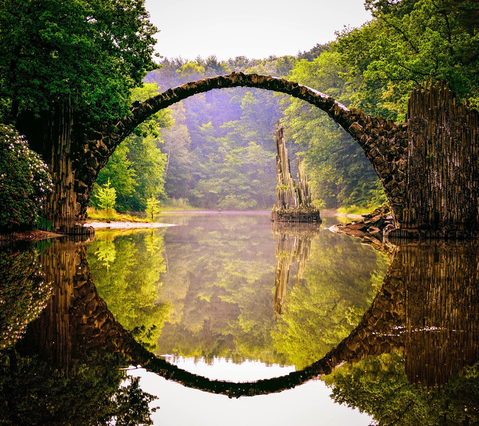 A view of a bridge over a river with a reflection in the water (bridge, devil, landscape, nature)