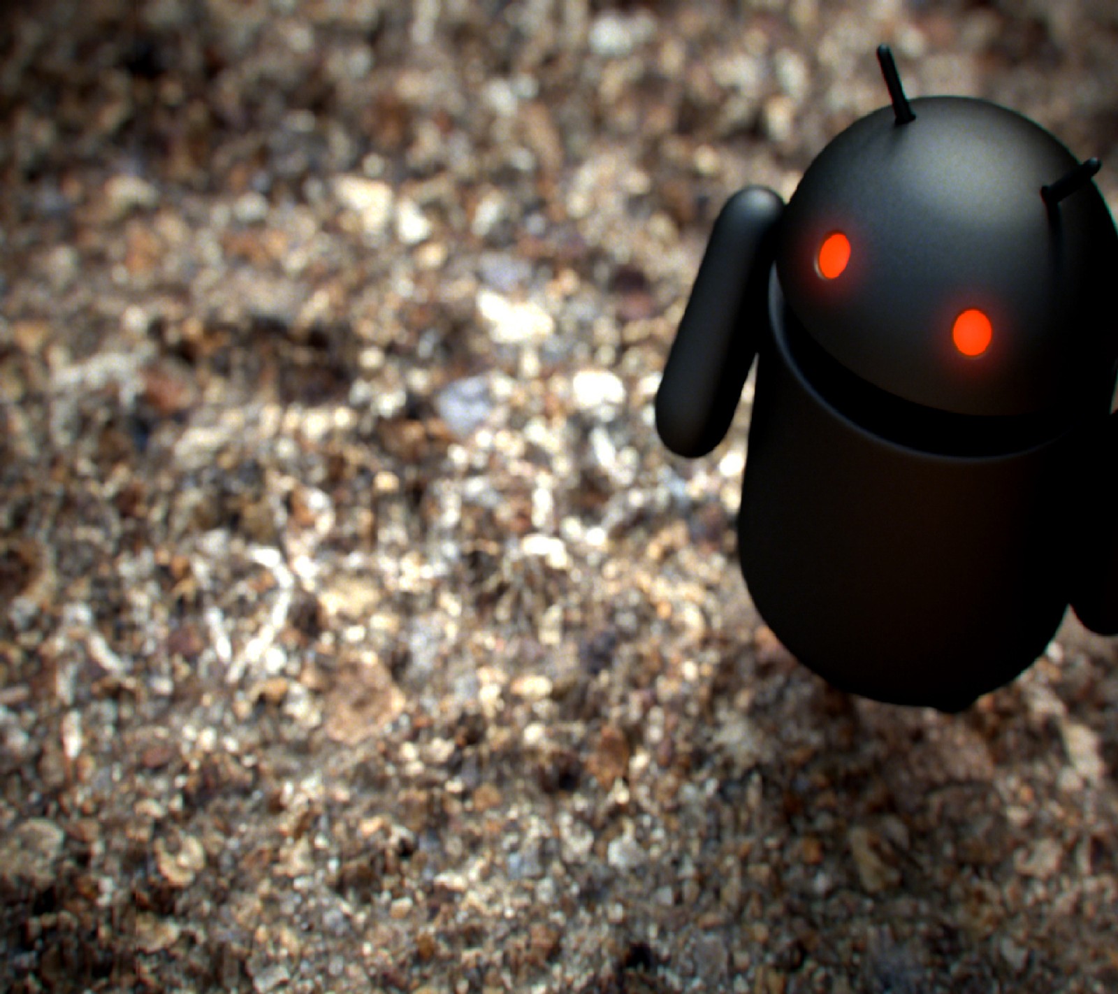 There is a small black robot with red eyes on the ground (android)