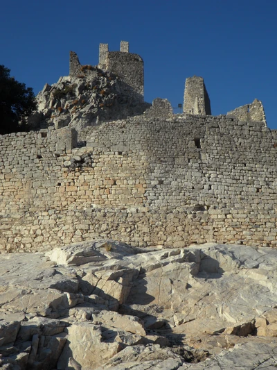 Ancient Castle Ruins Rising Above Rocky Outcrop