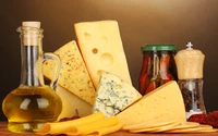 Fromages assortis avec de l'huile d'olive et des condiments