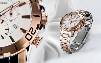 Reloj analógico elegante con acentos en oro rosa y pulsera de metal