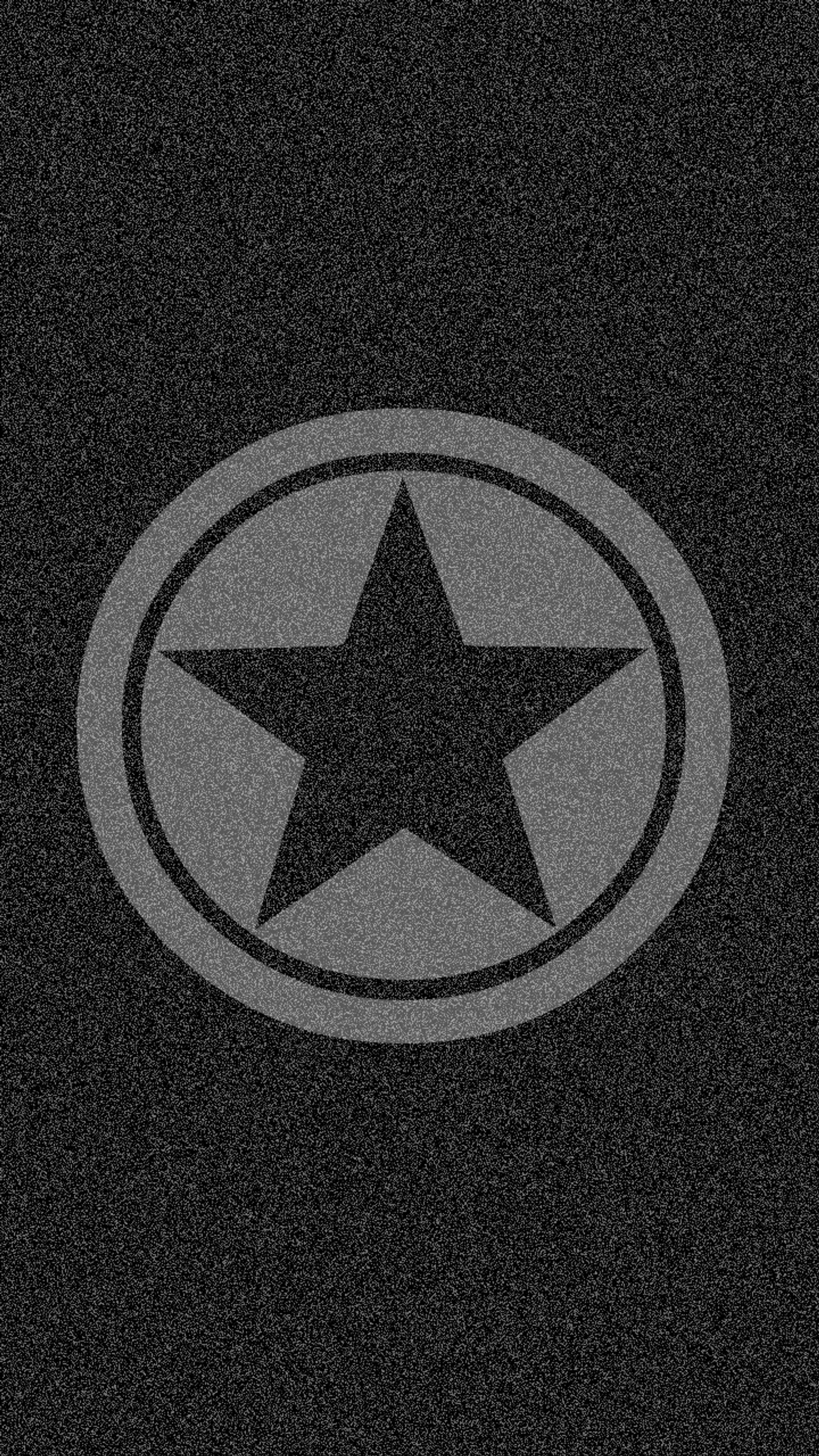 A close up of a star on a black background (dark, gray, logo, star, texture)