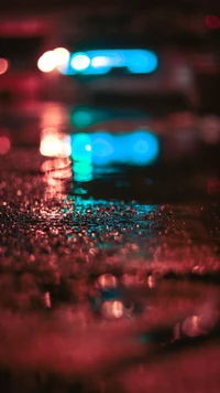 Vibrant Bokeh Reflections on Wet Surfaces at Night