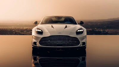 2024 Aston Martin Vanquish: Ein atemberaubendes Super GT V12 Sportauto in einer reflektierenden Sonnenuntergangs-Szenerie