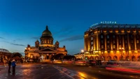 St. Isaac's Cathedral at twilight with the Astoria hotel in the background, capturing the essence of a vibrant cityscape.