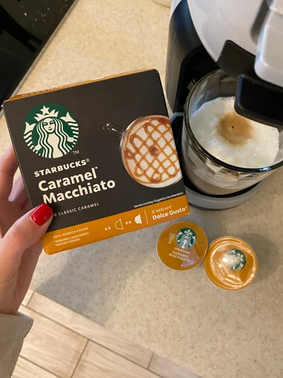 Starbucks Caramel Macchiato Pods Next to Coffee Machine