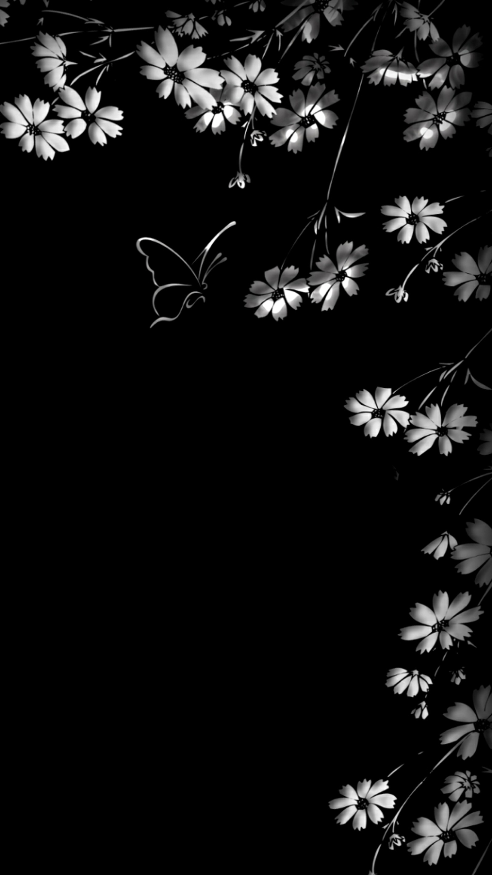 There is a black and white photo of a butterfly flying over a flower (black, butterfly, flowers, white)