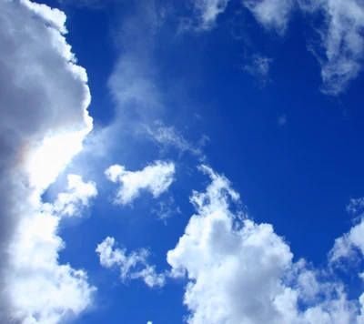 Vibrant Blue Sky with Fluffy White Clouds