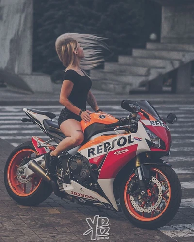 Empowered Biker Girl on a Honda Repsol Motorcycle