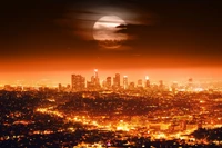 Horizonte capturado de Los Angeles ao crepúsculo sob uma lua dramática