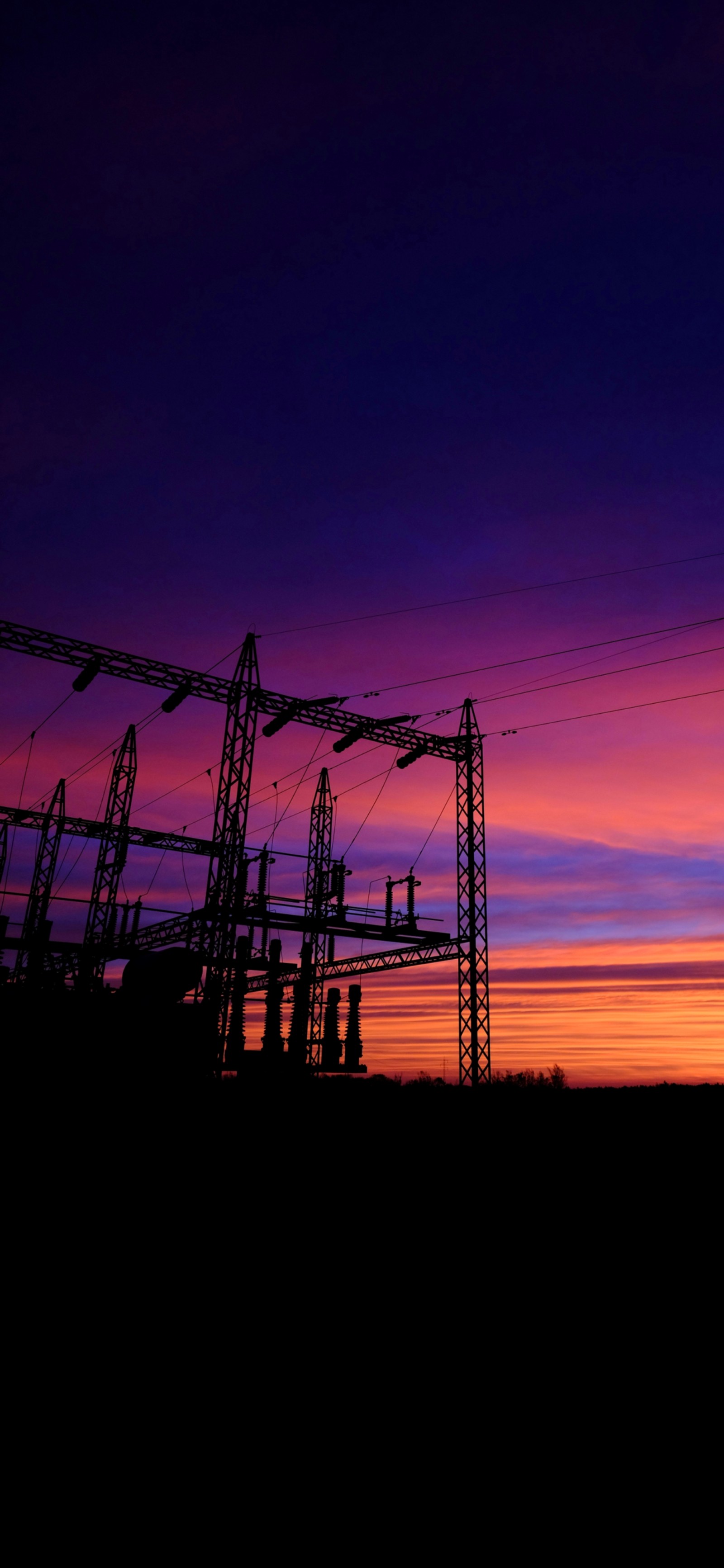 Arafed power lines at sunset with a purple sky (electricity, transmission tower, overhead power line, energy, dusk)