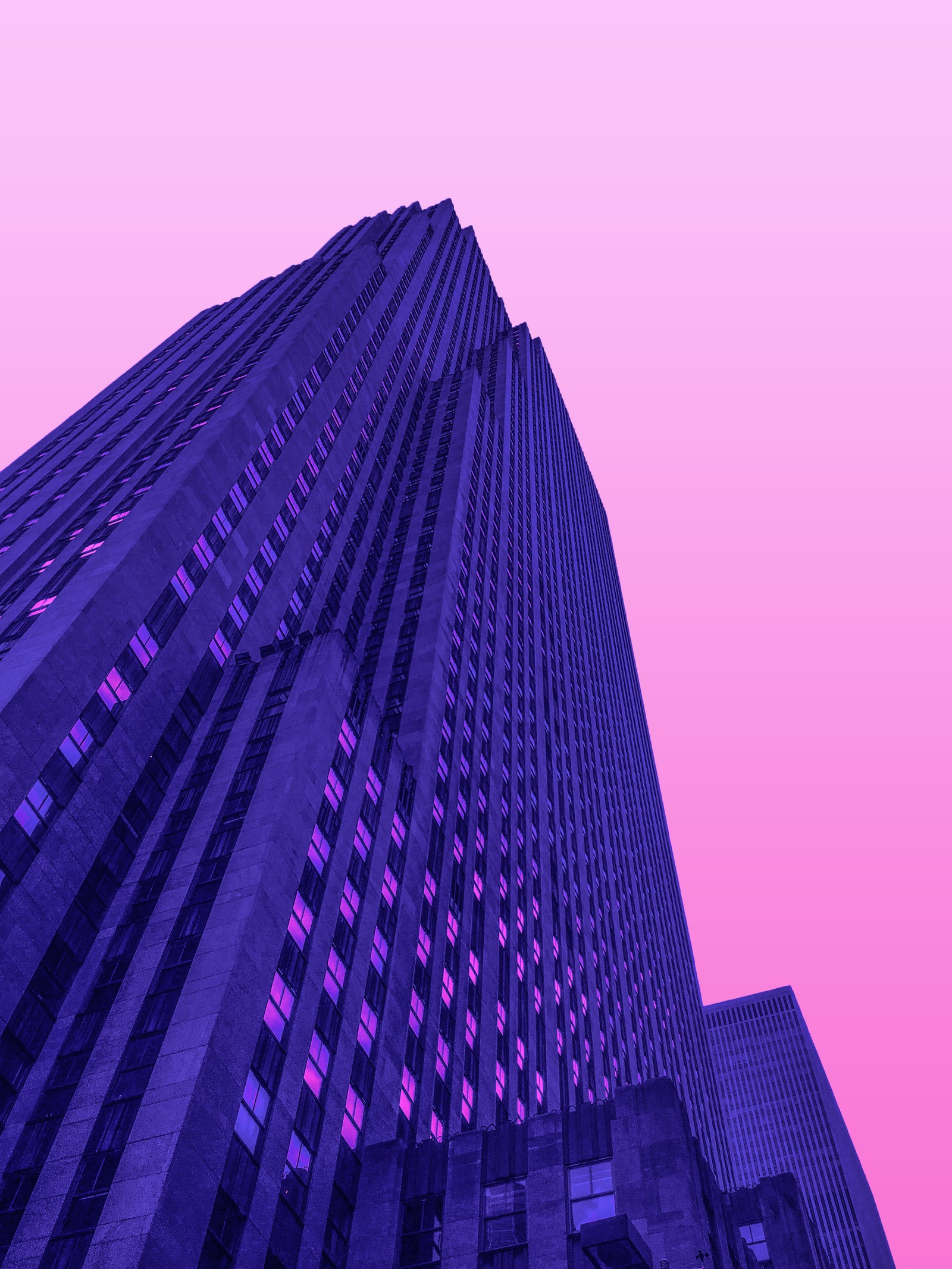 Purple and pink photograph of a tall building with a clock on the top (building, landmark, light, pink, purple)