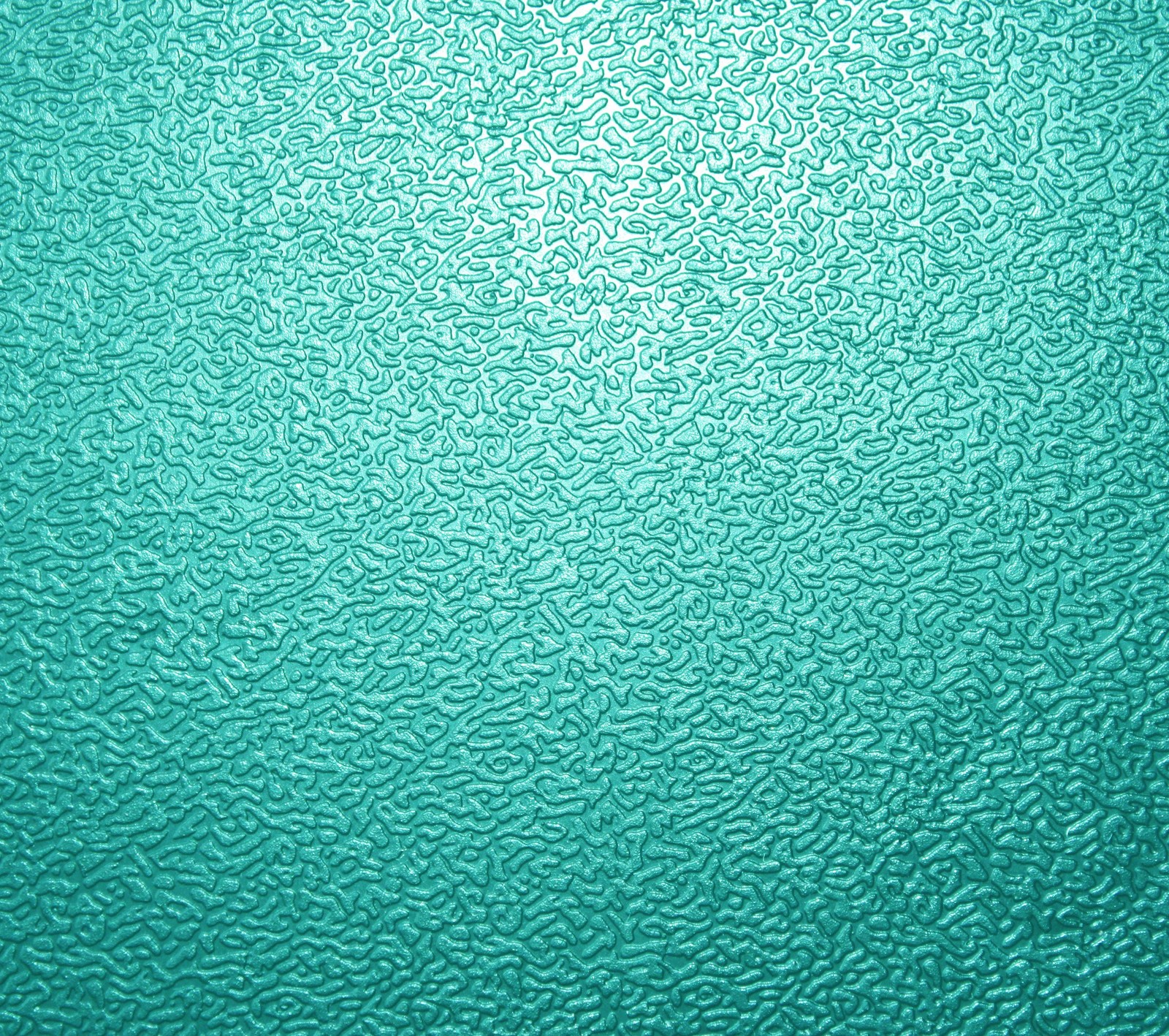 A close up of a green glass surface with a pattern (android, g3, galaxy, google, lg)