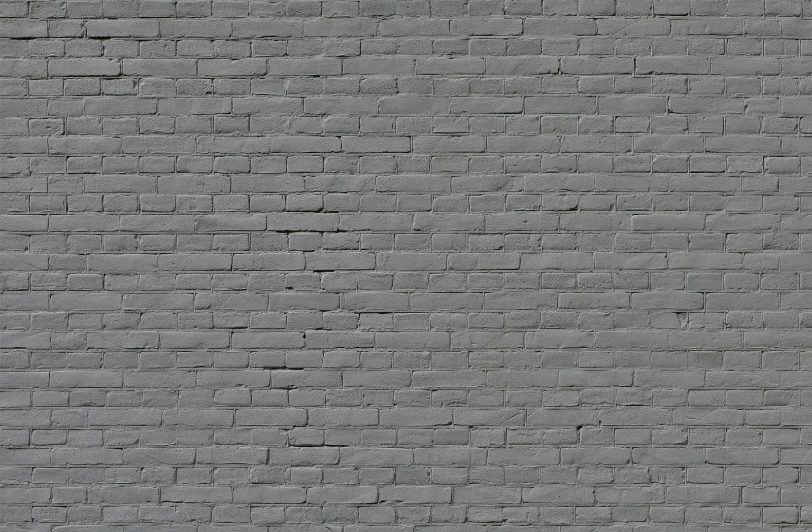 A close up of a fire hydrant in front of a brick wall (stone wall, wall, brickwork, brick, road surface)