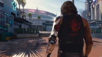 Personaje de Cyberpunk 2077 en Entorno Urbano: Una Instantánea Dinámica de Moda Futurista y Aventura